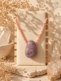 Amethyst teardrop pendant. Hand-knotted macramé.